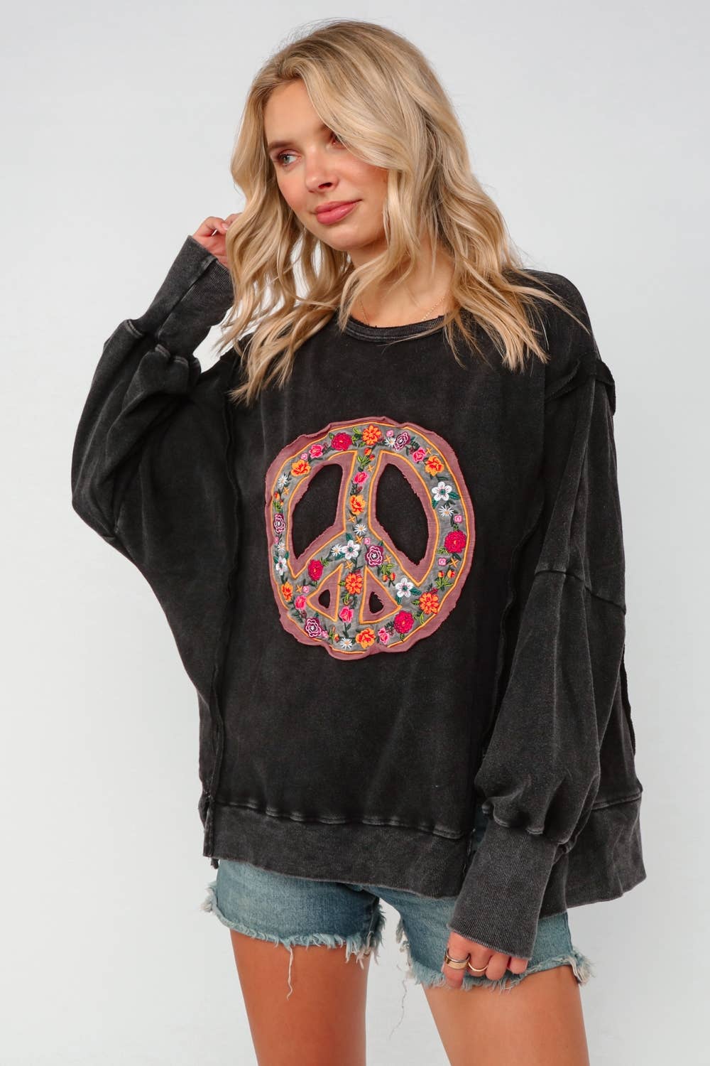 EMBROIDERED PEACE WASHED PULLOVER KNIT TOP